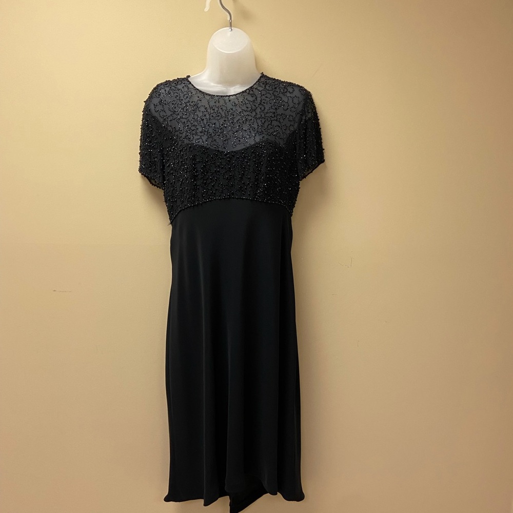 Celeste black dressy dress, black beaded top, solid black skirt.